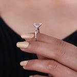 moonstone engagement ring paired with vintage gold ring and antique cushion cut diamond accents.