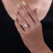 moonstone engagement ring paired with vintage gold ring and antique cushion cut diamond accents.