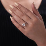 moonstone engagement ring paired with vintage gold ring and antique cushion cut diamond accents.