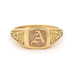 Elegant dainty gold initial ring with custom alphabet engraving in a sleek and stylish signet design