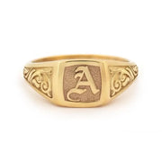 Elegant dainty gold initial ring with custom alphabet engraving in a sleek and stylish signet design