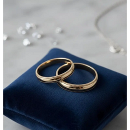 Minimalist matte finish couple rings for subtle elegance and modern love.