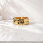 Silver couple rings with engraved date, personalized memory of love.