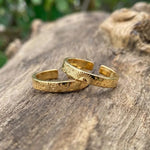 Silver couple rings with engraved date, personalized memory of love.