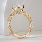 Elongated cushion cut lab grown diamond ring with vintage engraved gold band