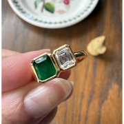 gemstone ring, emerald ring, radiant engagement ring in white gold with diamonds