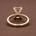 Radiant cut peach pink diamond ring with 14K gold pave band