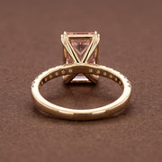 Radiant cut peach pink diamond ring with 14K gold pave band