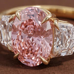 3 stone oval engagement ring with elegant diamond setting