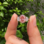 3 stone oval engagement ring with elegant diamond setting