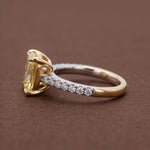 yellow radiant cut diamond ring with pave diamond band 