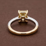 yellow radiant cut diamond ring with pave diamond band 