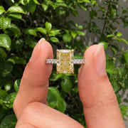 yellow radiant cut diamond ring with pave diamond band 