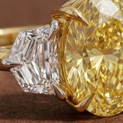 yellow oval cut diamond ring with baguette side stones in gold