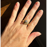 Elongated round cut engagement ring in yellow gold