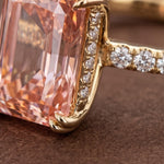 Radiant cut peach pink diamond ring with 14K gold pave band
