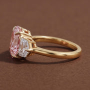 3 stone oval engagement ring with elegant diamond setting