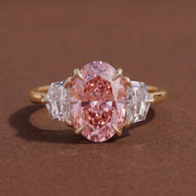 3 stone oval engagement ring with elegant diamond setting