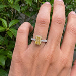 yellow radiant cut diamond ring with pave diamond band 