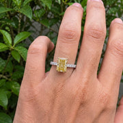 yellow radiant cut diamond ring with pave diamond band 