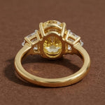 yellow oval cut diamond ring with baguette side stones in gold