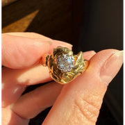 Elongated round cut engagement ring in yellow gold