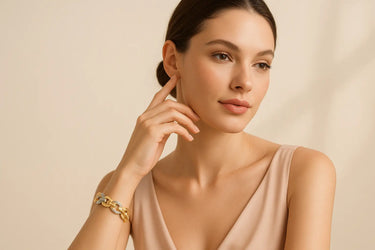 Woman wearing a gold bracelet on a beige background.bracelet made weith natural diamond and labgrown diamond. gift for her.made by jayamar gems